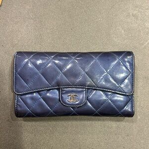 Fair condition Chanel continental wallet in blue patent leather.